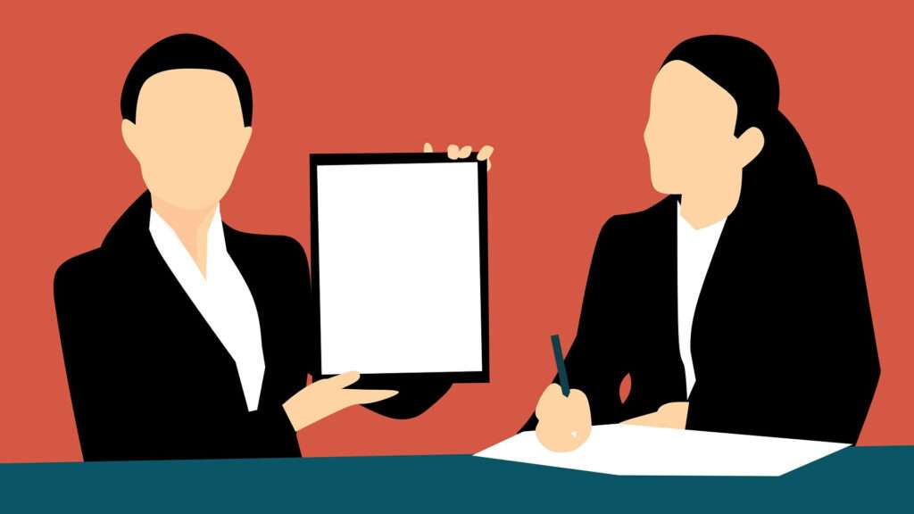 Zwei animierte Frauen sitzen an einem Tisch, die eine Frau hält ein Tablet in die Höhe, die andere schreibt etwas auf